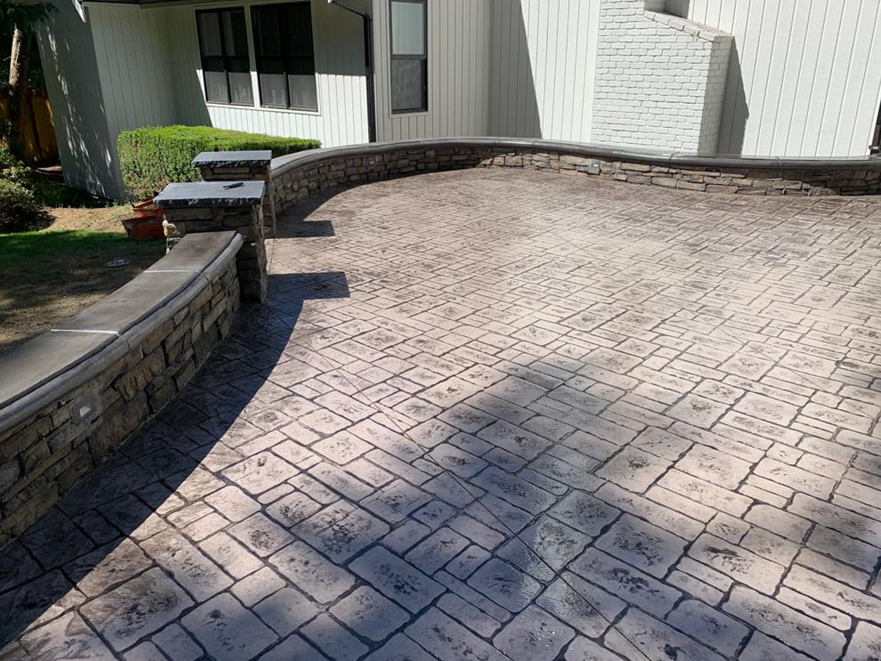 Beautifully crafted stamped concrete patios in Seattle, offering both style and functionality for outdoor living and landscaping needs